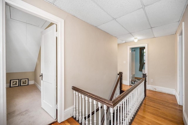89 Merrill Ave, Lowell, MA 01850 - hallway with an upstairs landing, attic access, a paneled ceiling, light wood finished floors, and baseboards