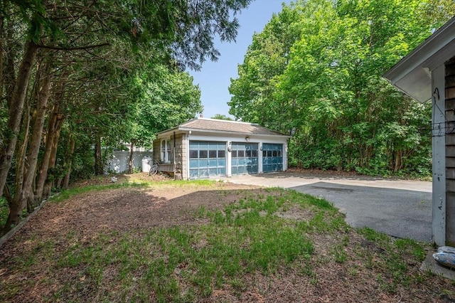 89 Merrill Ave, Lowell, MA 01850 - view of yard with a garage and an outbuilding