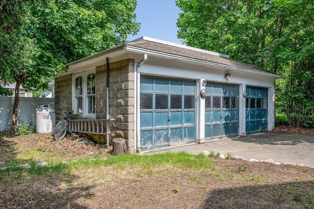 89 Merrill Ave, Lowell, MA 01850 - view of side of home featuring a garage and an outbuilding