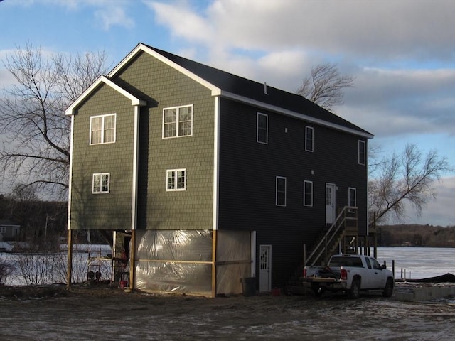 back of house with a garage