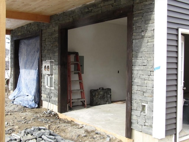 miscellaneous room with beamed ceiling and wood ceiling