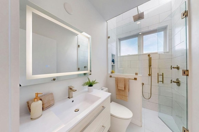 bathroom featuring a stall shower, toilet, and vanity