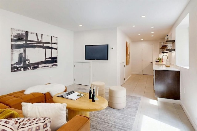 living room with recessed lighting, baseboards, and light tile patterned floors