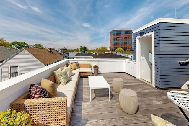 wooden terrace featuring an outdoor living space