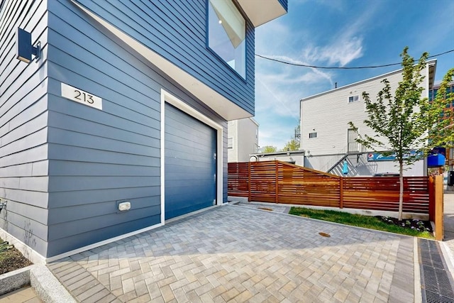 view of property exterior with fence