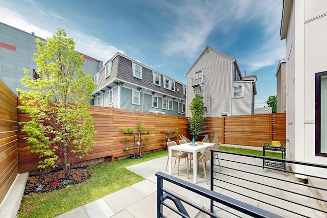 view of patio / terrace featuring a fenced backyard and outdoor dining area