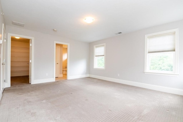 50 Brookview Rd Unit 50, Franklin, MA 02038 - unfurnished bedroom featuring carpet floors, a walk in closet, and connected bathroom