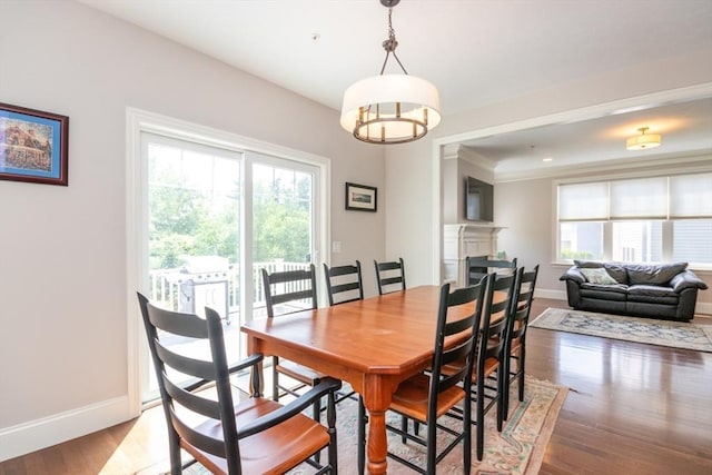 50 Brookview Rd Unit 50, Franklin, MA 02038 - dining space with plenty of natural light, light wood-style floors, a chandelier, and a fireplace