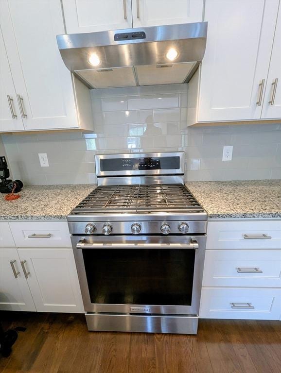 50 Brookview Rd Unit 50, Franklin, MA 02038 - kitchen featuring stainless steel gas stove, under cabinet range hood, white cabinetry, and dark wood finished floors