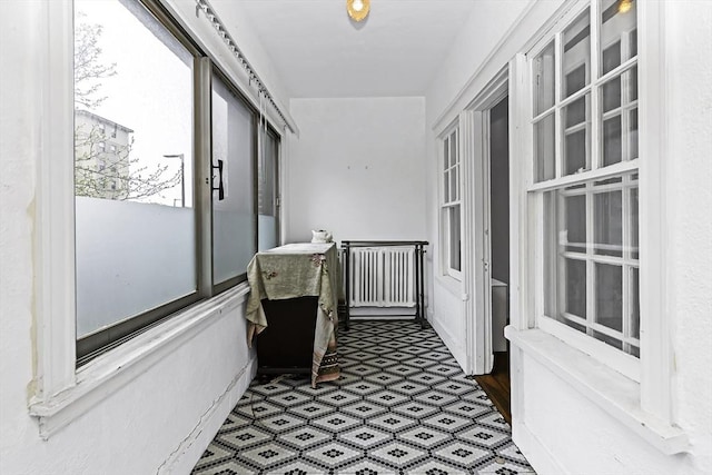 108 Washington St Unit 3, Boston, MA 02135 - unfurnished sunroom with radiator heating unit