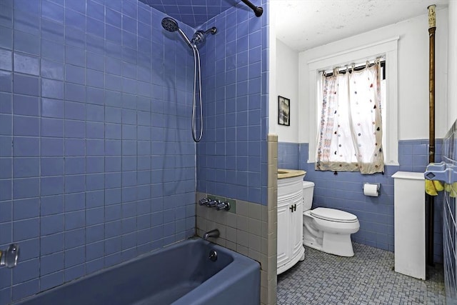 108 Washington St Unit 3, Boston, MA 02135 - full bath featuring bathing tub / shower combination, tile walls, a wainscoted wall, toilet, and tile patterned floors