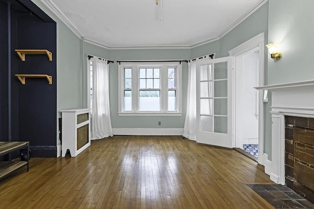108 Washington St Unit 3, Boston, MA 02135 - unfurnished living room with a fireplace with flush hearth, wood-type flooring, crown molding, and baseboards