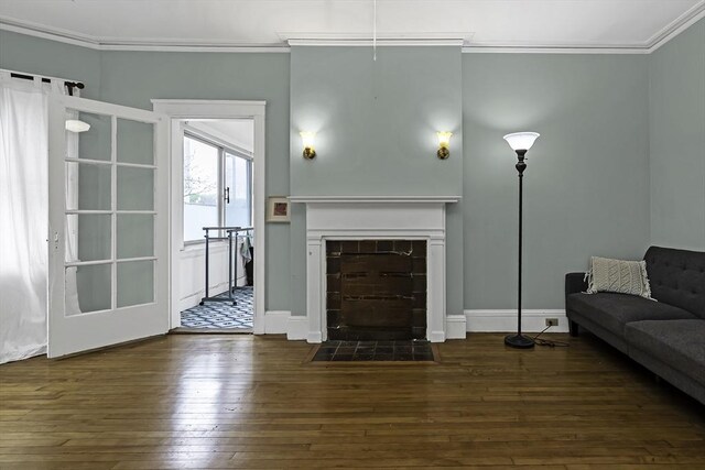 108 Washington St Unit 3, Boston, MA 02135 - living room featuring dark wood finished floors, ornamental molding, a fireplace, and baseboards