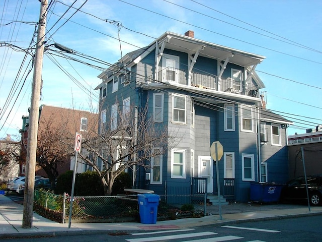 270-272 Sidney St, Cambridge, MA 02139 - view of front of house featuring a balcony and a chimney