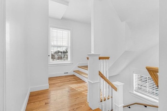 stairs with wood-type flooring