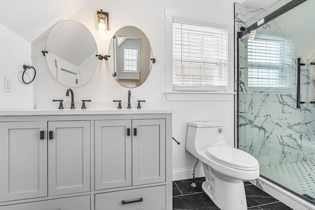 bathroom featuring an enclosed shower, vanity, and toilet