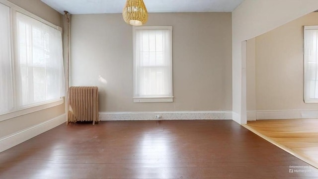48 Summer St, Adams, MA 01220 - spare room with radiator, healthy amount of natural light, and wood finished floors