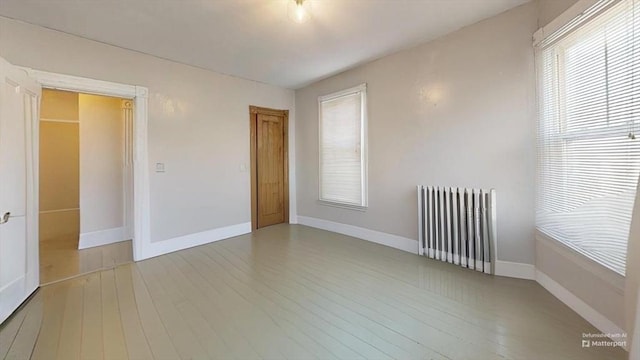 48 Summer St, Adams, MA 01220 - unfurnished room featuring radiator and wood finished floors
