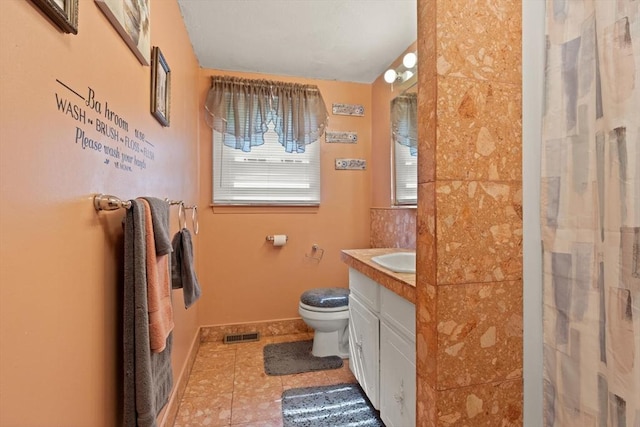 26 Hemlock Ter, Randolph, MA 02368 - bathroom with toilet, tile patterned floors, vanity, and curtained shower