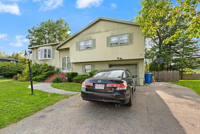 26 Hemlock Ter, Randolph, MA 02368 - split foyer home with asphalt driveway and an attached garage