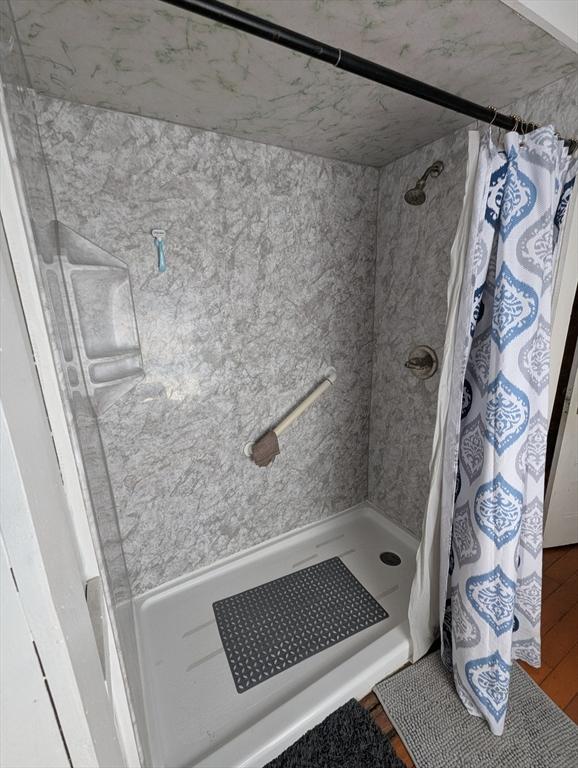 full bathroom with a shower with curtain