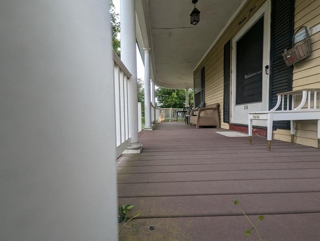 wooden deck featuring covered porch