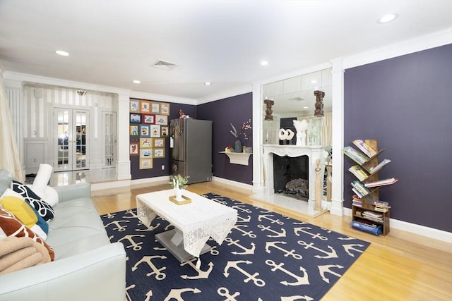 20 Albee Dr, Braintree, MA 02184 - living area featuring crown molding, decorative columns, wood finished floors, a fireplace, and baseboards