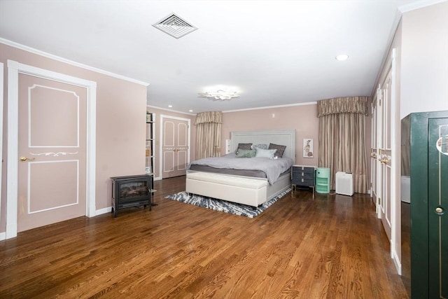 20 Albee Dr, Braintree, MA 02184 - bedroom featuring a wood stove, wood finished floors, ornamental molding, and recessed lighting