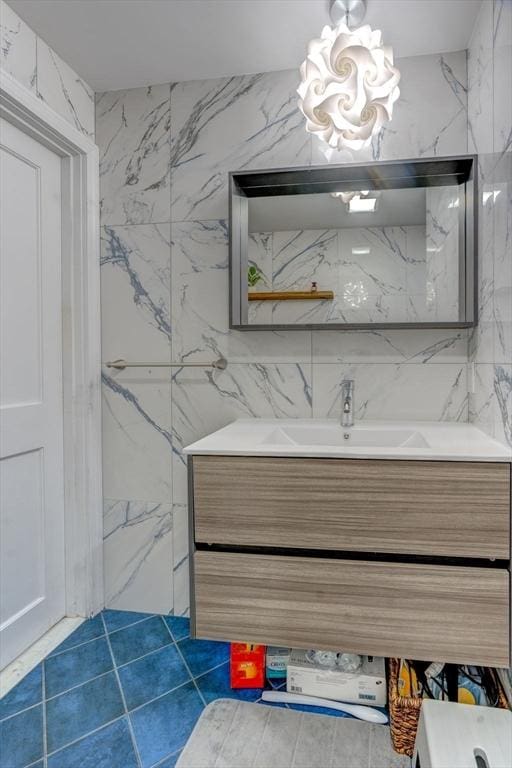 20 Albee Dr, Braintree, MA 02184 - bathroom featuring vanity, a chandelier, and tile walls