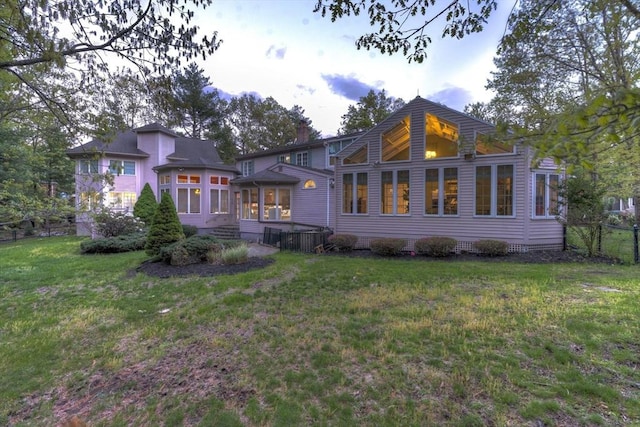 20 Albee Dr, Braintree, MA 02184 - rear view of property with a sunroom and a chimney