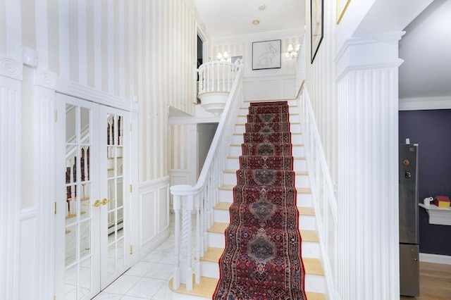 20 Albee Dr, Braintree, MA 02184 - stairway with french doors, baseboard heating, crown molding, and a decorative wall