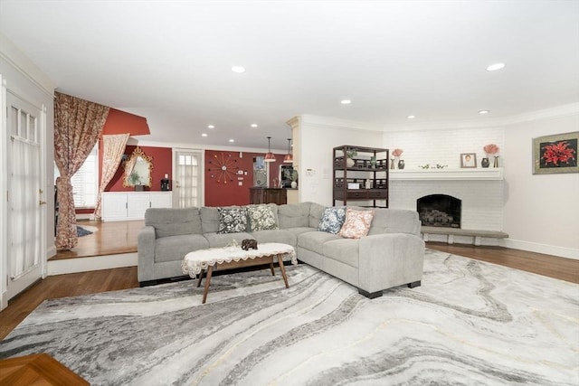 20 Albee Dr, Braintree, MA 02184 - living room with wood finished floors, crown molding, recessed lighting, and a fireplace
