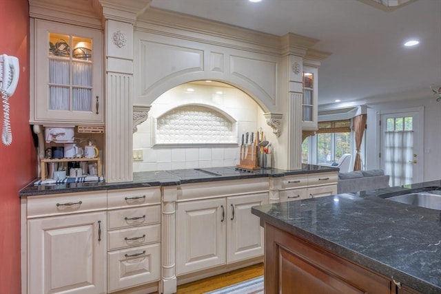 20 Albee Dr, Braintree, MA 02184 - kitchen featuring glass insert cabinets, tasteful backsplash, dark stone countertops, recessed lighting, and a sink
