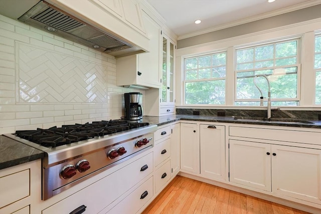 5 Baxter St, Westborough, MA 01581 - kitchen with ventilation hood, stainless steel gas cooktop, ornamental molding, a sink, and backsplash
