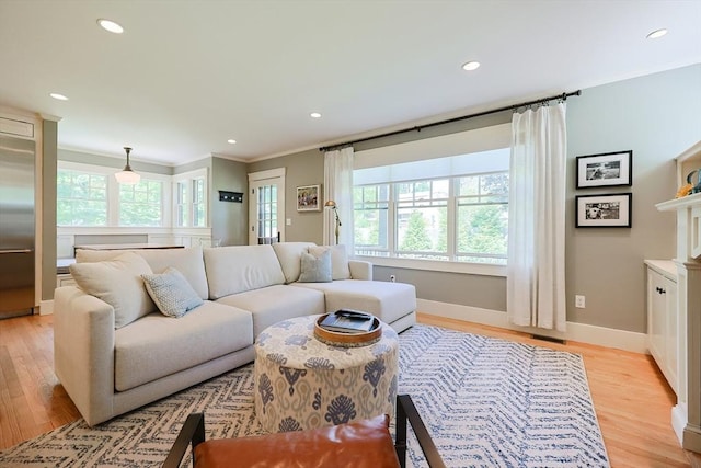 5 Baxter St, Westborough, MA 01581 - living area with crown molding, recessed lighting, baseboards, and light wood-style floors