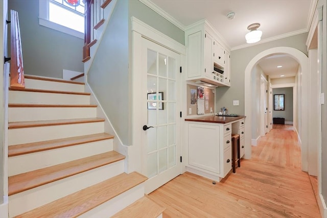 5 Baxter St, Westborough, MA 01581 - corridor with arched walkways, light wood-type flooring, stairs, and crown molding