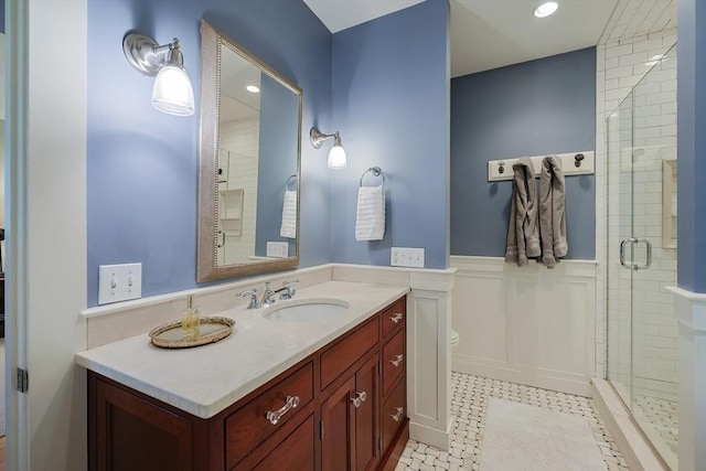 5 Baxter St, Westborough, MA 01581 - bathroom featuring a shower stall, a wainscoted wall, vanity, a decorative wall, and tile patterned floors