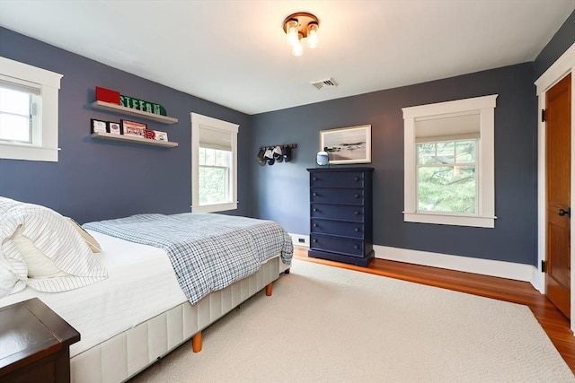 5 Baxter St, Westborough, MA 01581 - bedroom with multiple windows, wood finished floors, and baseboards