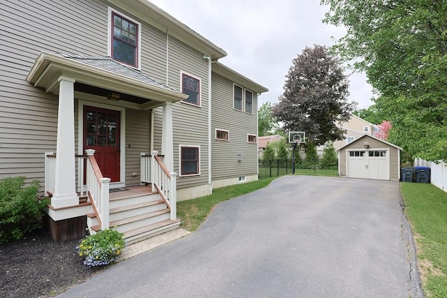 5 Baxter St, Westborough, MA 01581 - view of front of home featuring a garage, driveway, and an outbuilding