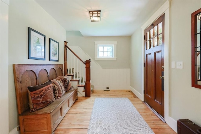 5 Baxter St, Westborough, MA 01581 - entryway featuring stairs, light wood finished floors, wainscoting, and baseboards