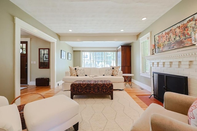 5 Baxter St, Westborough, MA 01581 - living room featuring light wood-type flooring, baseboards, a brick fireplace, and recessed lighting