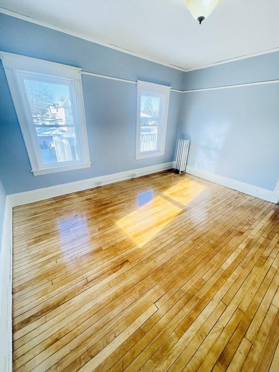 empty room with light hardwood / wood-style floors