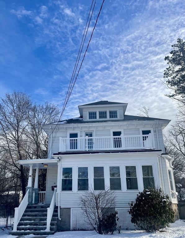 view of front of property with a balcony and a porch