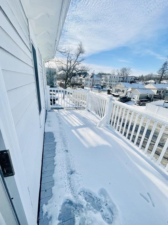 view of yard layered in snow