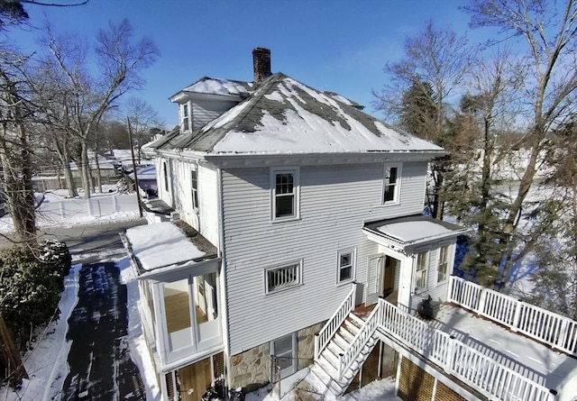 view of snow covered house