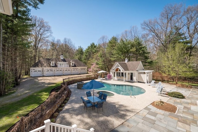 view of swimming pool with a patio area and an outdoor structure