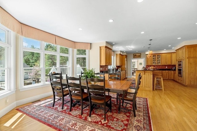 dining area featuring light hardwood / wood-style floors and plenty of natural light