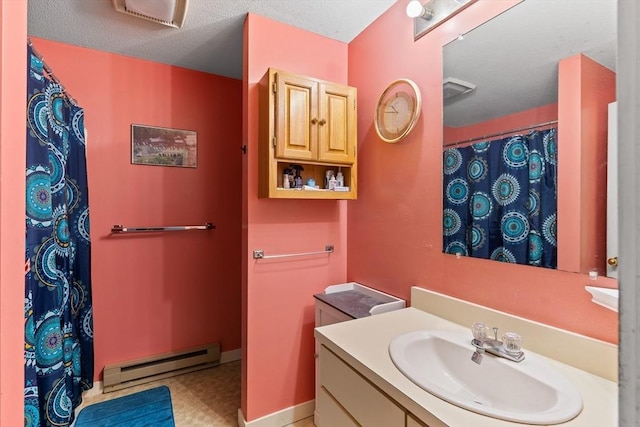 23 Randolph Pl Unit 301, Northampton, MA 01060 - full bath featuring baseboard heating, vanity, tile patterned floors, and a shower with shower curtain