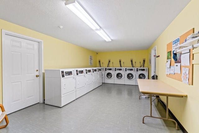 23 Randolph Pl Unit 301, Northampton, MA 01060 - communal laundry room featuring washing machine and clothes dryer, a textured ceiling, and tile patterned floors