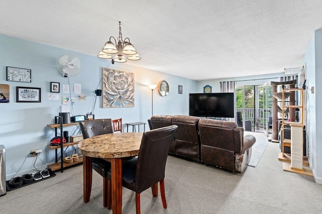 23 Randolph Pl Unit 301, Northampton, MA 01060 - carpeted dining space featuring a chandelier and a textured ceiling